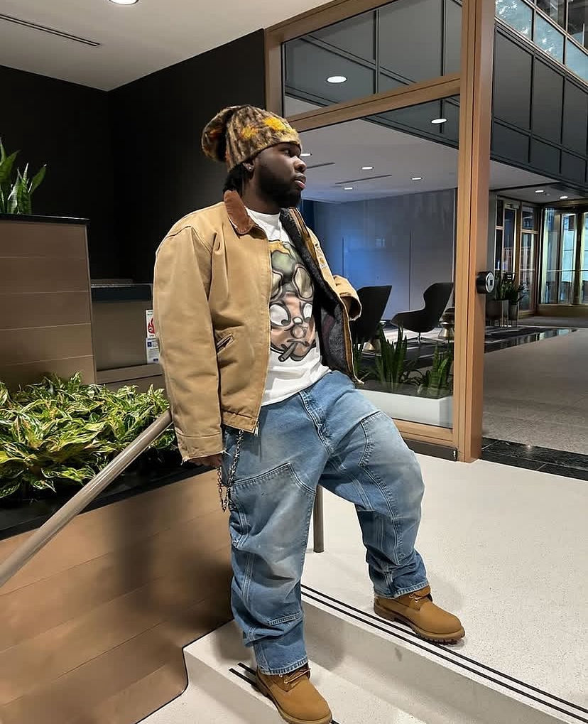 Customer in the Vertidíem Fight for Freedom tee with a work jacket and baggy jeans