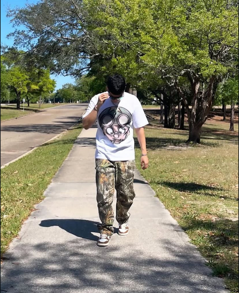 Customer walking in the Vertidíem Fight for Freedom tee with camo pants
